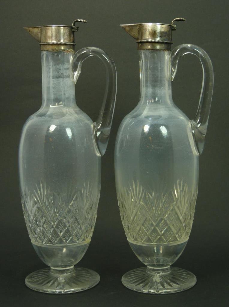 PR ANTIQUE FRENCH CUT CRYSTAL CLARETS: PR ANTIQUE FRENCH CUT CRYSTAL CLARETS French hallmarked. Each stands 12" tall (30.48cm) with French hallmarked silver top. Pin wheel cut to base possibly old Baccarat, with applied handles. Turn of th