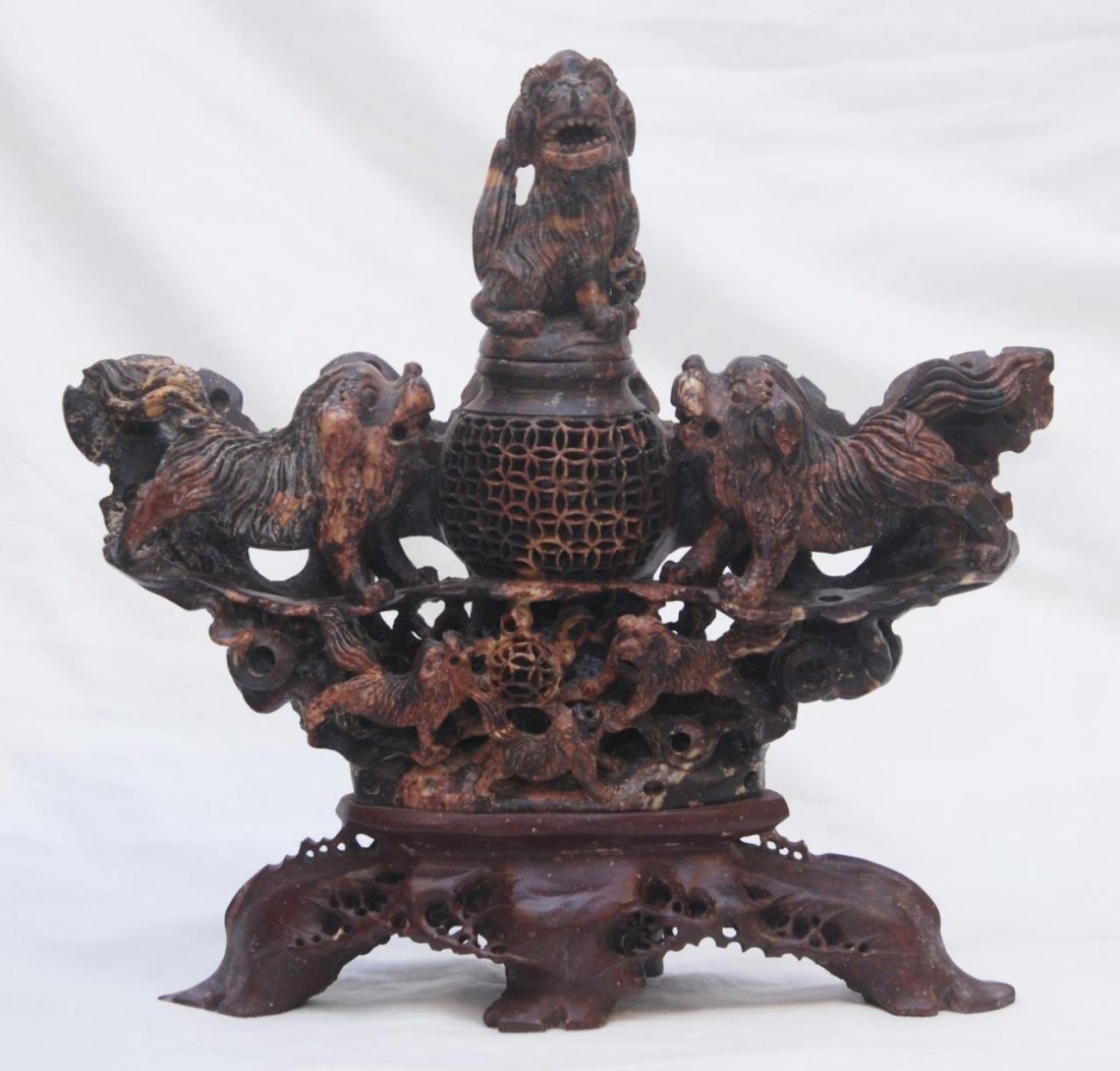 ANTIQUE CHINESE CARVED SOAPSTONE INCENSE BURNER: ANTIQUE CHINESE CARVED SOAPSTONE INCENSE BURNER With dog display reticulate incense burner to top. Measures 8" tall (20.32cm) x 12" wide (30.48cm) Early to mid 20th century. Total weight 3882g