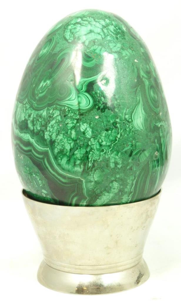 HUGE CARVED MALACHITE EGG WITH HOLDER: HUGE CARVED MALACHITE EGG WITH HOLDER Comes with silver holding base. Measures 7" tall (17.78cm). Total weight 5039g