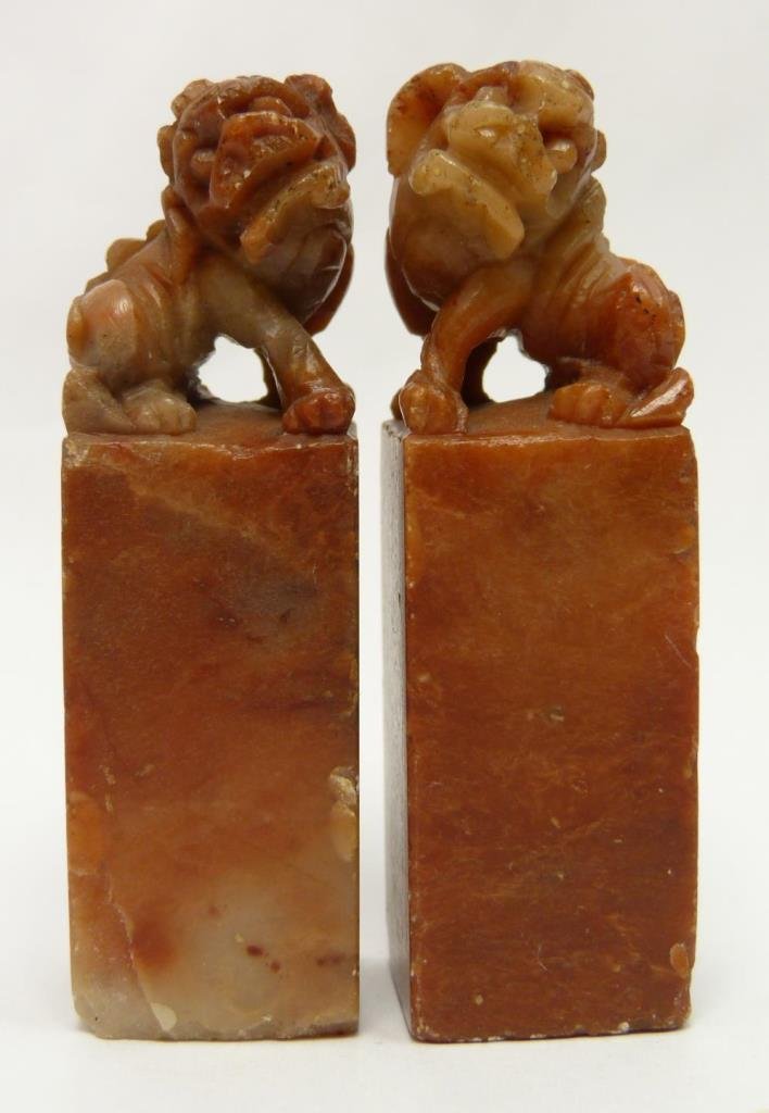 PR SOAPSTONE 20TH CENTURY FOO DOG SEALS: PR SOAPSTONE 20TH CENTURY FOO DOG SEALS Pair of Hand Carved Soapstone Foo Dog Chop Seals. Each measures 2-5/8" tall (6.66cm). Total weight 116.6g