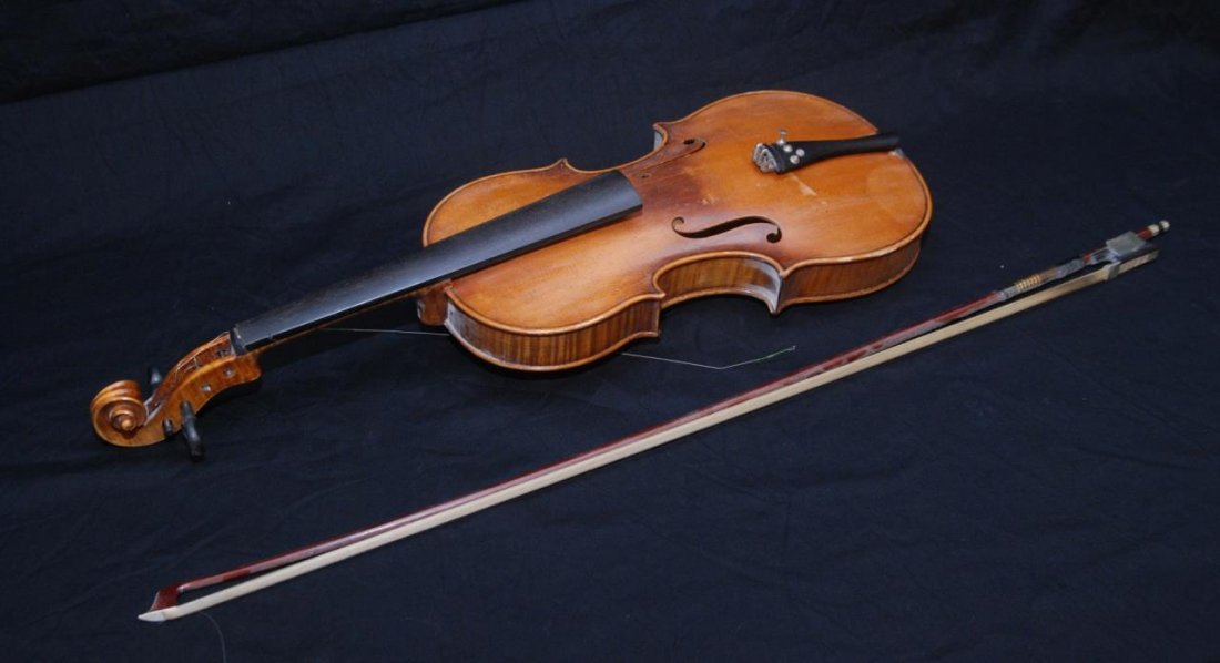 HEINRICH E. HEBERLEIN JR 1921 VIOLIN: HEINRICH E. HEBERLEIN JR 1921 VIOLIN German made from one of the famous violin makers of the 20th century. Measures 23" long (58.42cm). Comes with a bow by W. R. Schuster considered on of the best bow