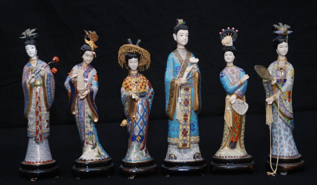 SET OF 6 CHINESE CLOISONNE AND BISQUE QUAN YIN: SET OF 6 CHINESE CLOISONNE AND BISQUE QUAN YIN Each beautifully painted with ethnic grab holding various items, from flowers to scepters. Each comes on fitted wooden base. Tallest being 10-1/2" tall (