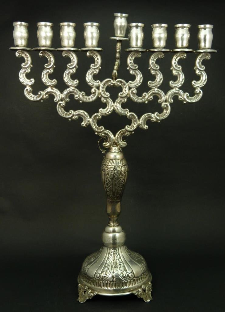 IMPORTANT LARGE STERLING SILVER MENORAH: IMPORTANT LARGE STERLING SILVER MENORAH Measures 17-1/2" tall (44.45cm) x 13" wide (33.02cm). Comes with small pitcher for oil. Marked to base sterling 925. Total weight 26ozt