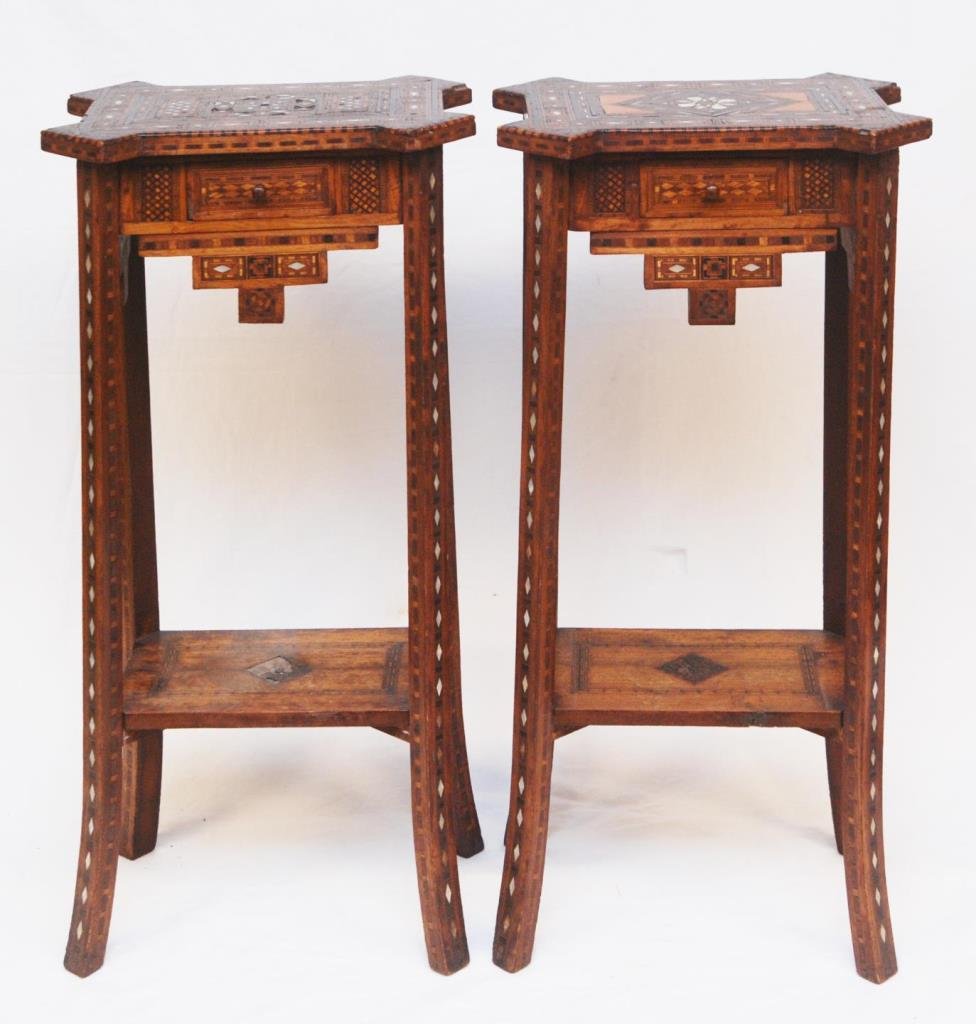PAIR ANTIQUE MOROCCAN END TABLES: PAIR ANTIQUE MOROCCAN END TABLES Each measures 27-1/2" tall (69.85cm) x 14" wide (35.56cm). Inlay with mother of pearl and 3 different woods. Each has a bottom shelf which is also inlay. Table dates t