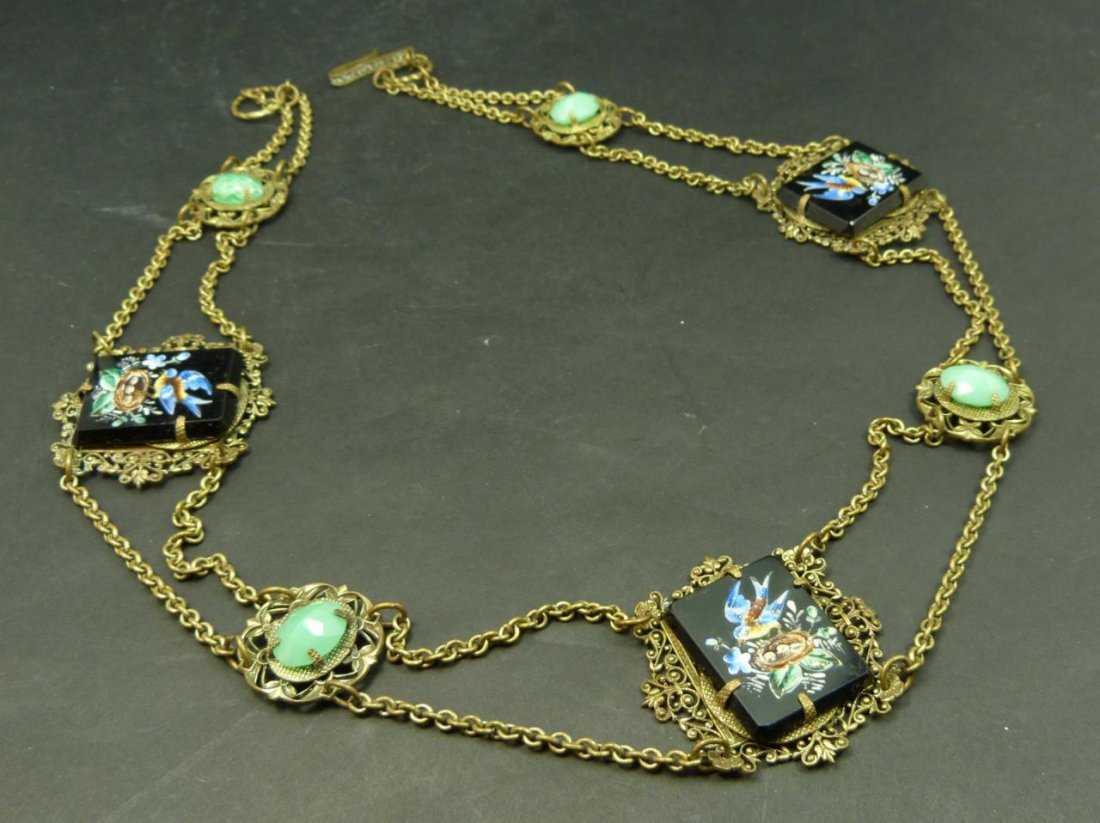 ANTIQUE CHINESE GEMSTONE DECORATED BELT: ANTIQUE CHINESE GEMSTONE DECORATED BELT Measures 29" long (73.66cm). Enamel decorated onyx and 4 jadeite cabochon stones. Late 19th century. Total weight 129g