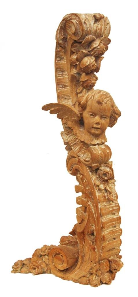 ANTIQUE CONTINENTAL WOODEN FLOOR BRACKET: Antique Continental Rococo carved wooden floor bracket depicting cherubs with scrolled floral designs. Circa late 19th to early 20th century. Measures approx. 42 1/2" height x 17" depth x 21" width.