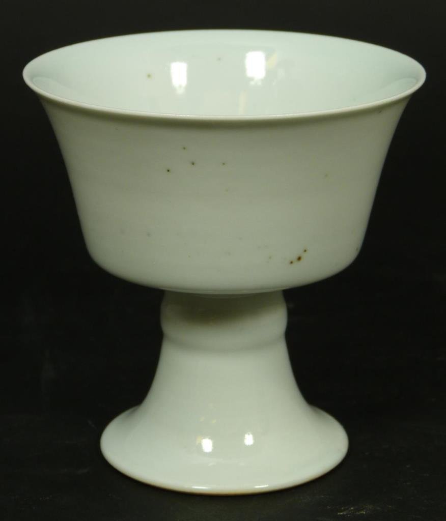 CHINESE WHITE GLAZE PORCELAIN STEM CUP: Antique Chinese Qing Dynasty Period white glazed porcelain stem cup. Bottom holds six character archaic Qianlong (1736-1795) reign mark, but possibly made later. Measures 2 3/4" Height x 3 3/4" Diamet