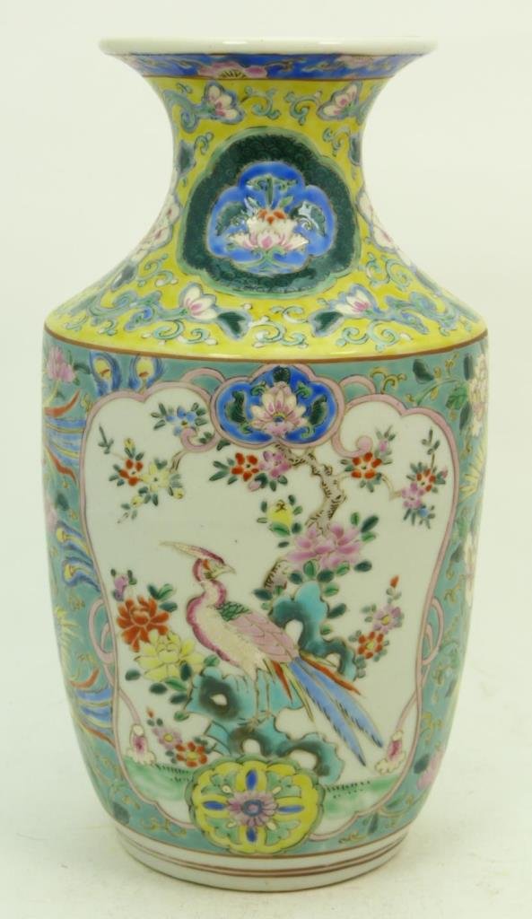 CHINESE FAMILLE ROSE BIRDS OF PARADISE VASE: Old Chinese hand painted enameled Famille Rose porcelain vase depicting Paradise birds. Nicely painted throughout with yellow and turqouise grounds. Circa late 19th to early 20th century. Measures 9 1