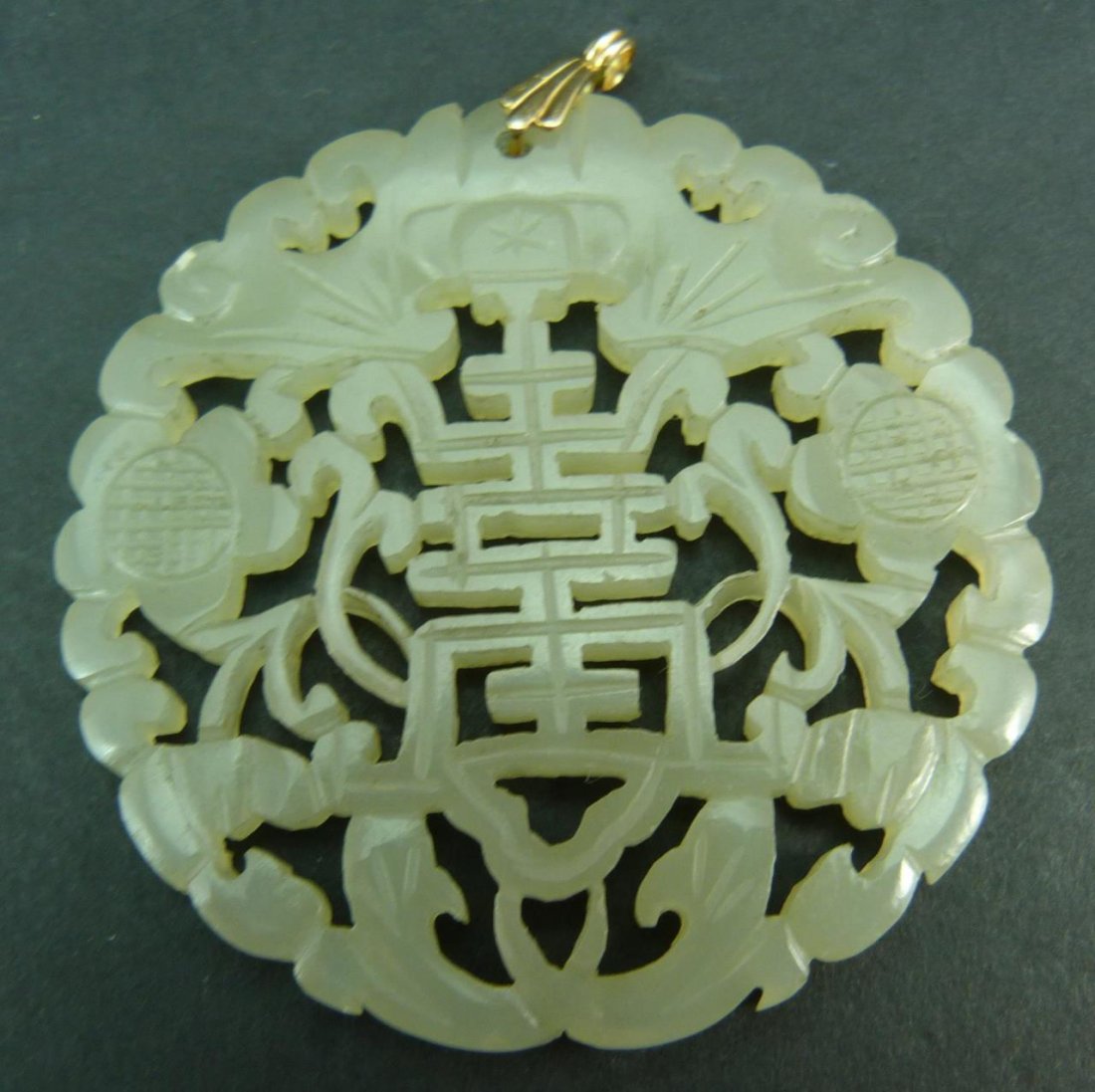ANTIQUE CHINESE WHITE JADE CARVED PENDANT W/ GOLD: ANTIQUE CHINESE WHITE JADE CARVED PENDANT WITH 14 KT YELLOW GOLD BAIL Measures 2 1/4"(5.72cm) wide 19/20century total weight 23 grams