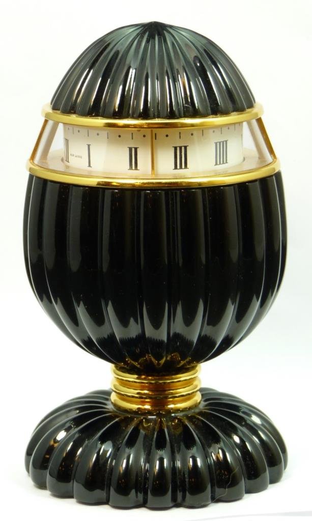 RARE FRENCH BACCARAT BLACK NOIR CLOCK: RARE FRENCH BACCARAT BLACK NOIR CLOCK Egg shaped with base. Black glass. Stamped Baccarat to base. Measures 5-1/2" tall (13.97cm). Retail price in excess of $2000. Total weight 1349g