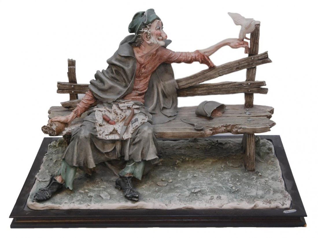 OLD G. ARMANI ITALIAN PORCELAIN FIGURE LARGE BUM: Original large Giuseppe Armani sculpture depicting seated bum on bench feeding a bird. This piece was designed and sculpted by Giuseppe Armani while he was still working at Capodimonte. Holds GA mark