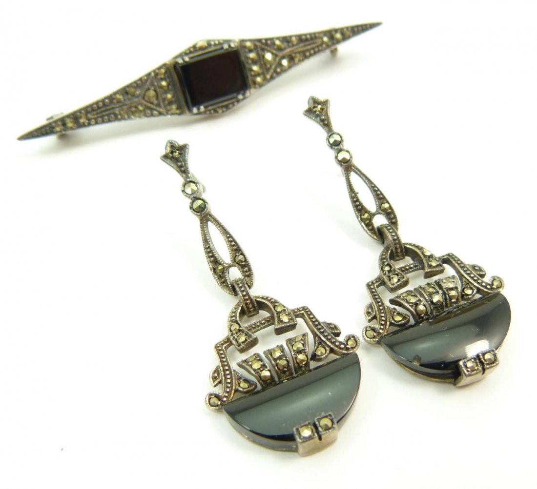 VINTAGE STERLING MARCASITE & ONYX SUITE: A vintage sterling silver marcasite & onyx jewelry suite. Circa early to mid 20th century. 2 1/2" pin with Pr. chandelier earrings. Total weight approx. 12 grams.