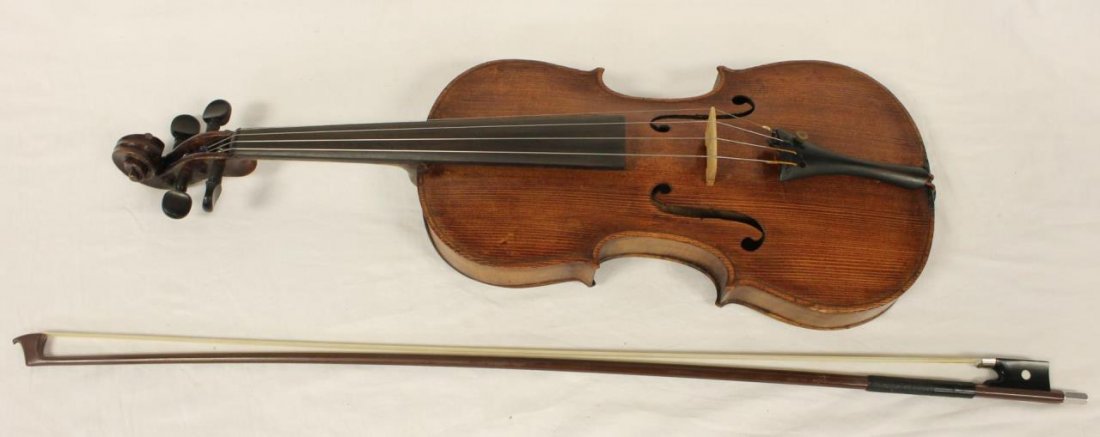 JOSEPH GUARNERIUS 1741 MODEL VIOLIN: JOSEPH GUARNERIUS 1741 MODEL VIOLIN One of the most prolific violin makers of the past 250 years, violin measures 23"(58.42cm) long, comes with a bow and original case. total weight on the violin 428 