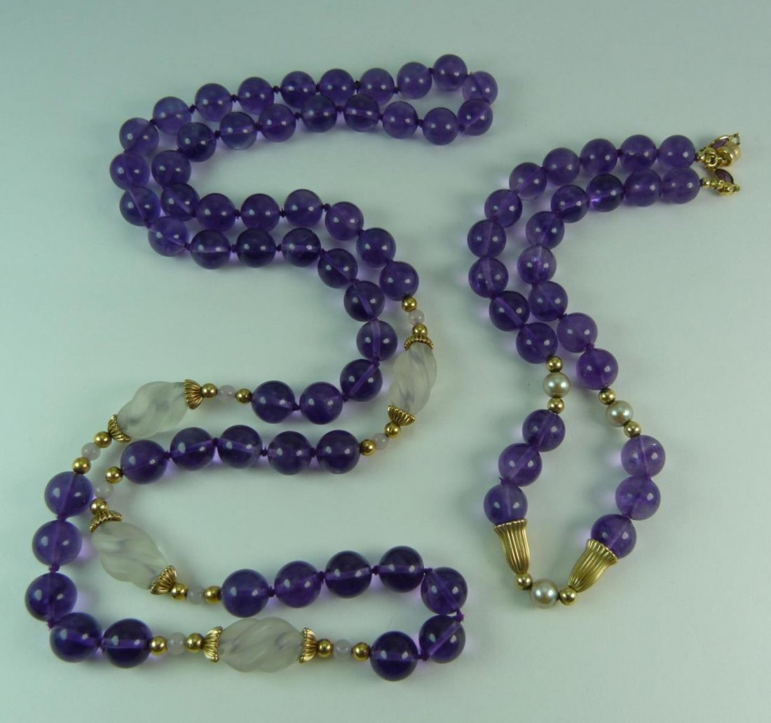 14KT YELLOW GOLD & AMETHYST GLASS JEWELRY SUITE: 14kt yellow gold and amethyst glass jewelry suite. Consisting of a 30" Necklace & 14" Choker necklace. Each has 14kt yellow gold spacers which separate amethyst glass beads. Total weight 125 Grams.