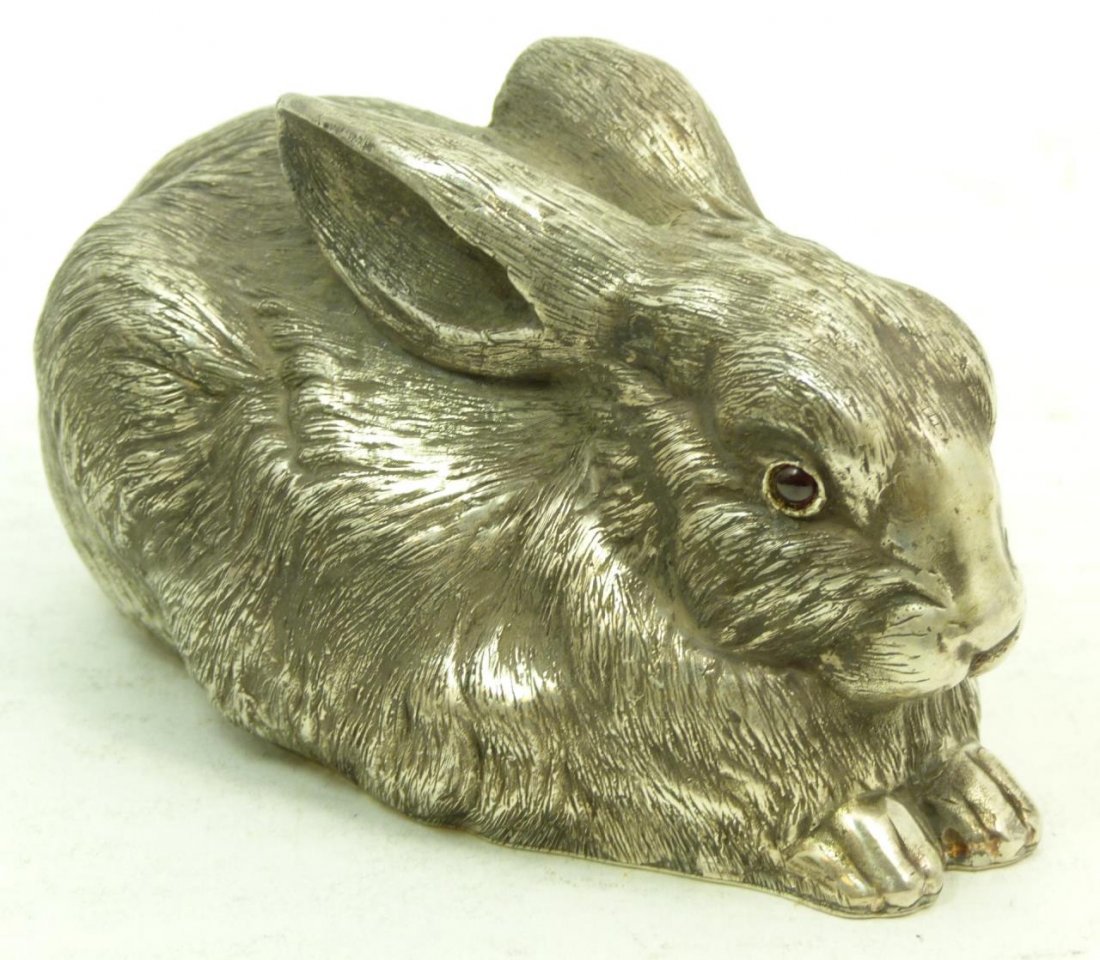 RUSSIAN SILVER BUNNY RABBIT W/ RED GARNET EYES: Russian silver bunny rabbit with red garnet eyes. Bears the Russian silver mark. Measures 4"(10.16cm) long. Total weight 12ozt