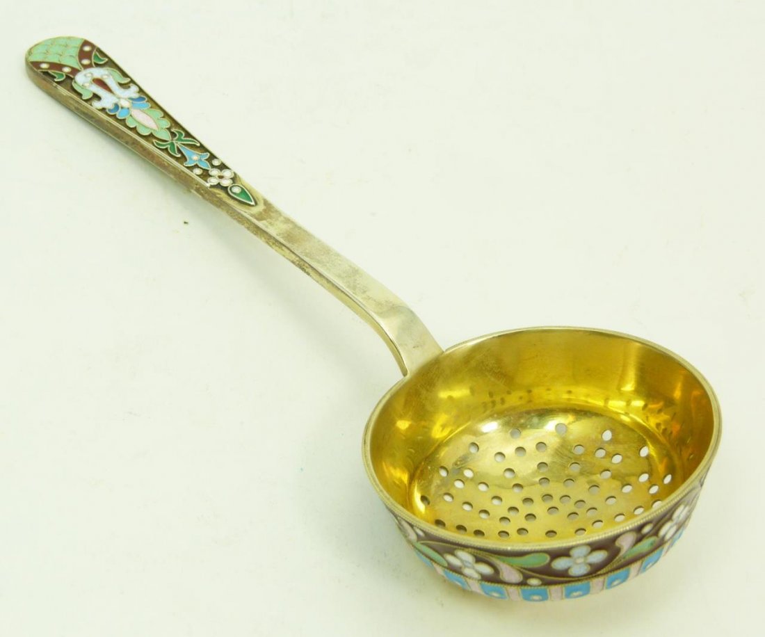 RUSSIAN SILVER & ENAMEL TEA STRAINER: Russian silver and enamel tea strainer. Holds Pavel of Ovchinnikov Cyrillic work master mark. Measures 6 3/4" (17.145cm) length. Weighs 2.5ozt.