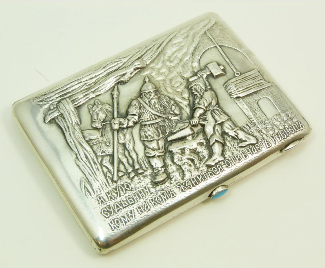 ANTIQUE RUSSIAN SILVER CIGARETTE BOX: ANTIQUE RUSSIAN SILVER CIGARETTE BOX With Russian writing to front. Depicting a soldier and a blacksmith. Bears the 84 mark for Russian silver. Measures 3" (7.62cm) x 4" (10.16cm). Total weight 168g.