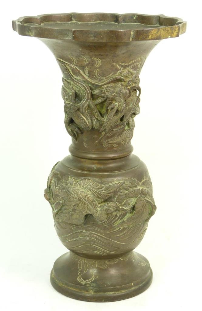 ANTIQUE JAPANESE LARGE BRONZE DRAGON RELIEF VASE: Japanese antique large bronze vase with dragons circumventing the vase in thick relief. Vase is unsigned, Dates 19th century. Measures 12"(30.48cm) Height. Total weight 2.2kg.