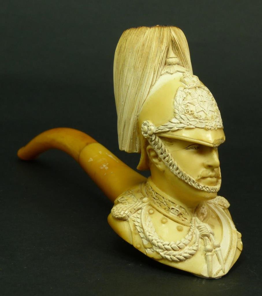 ANTIQUE MEERSCHAUM OF A BRITISH CAVALRY SOLDIER: Antique carved Meerschaum pipe of a British cavalry soldier with fabulous detail. Measures 4" (10.16cm) Length with a 3" (7.62cm) bakelite mouth piece. Total weight 75g.