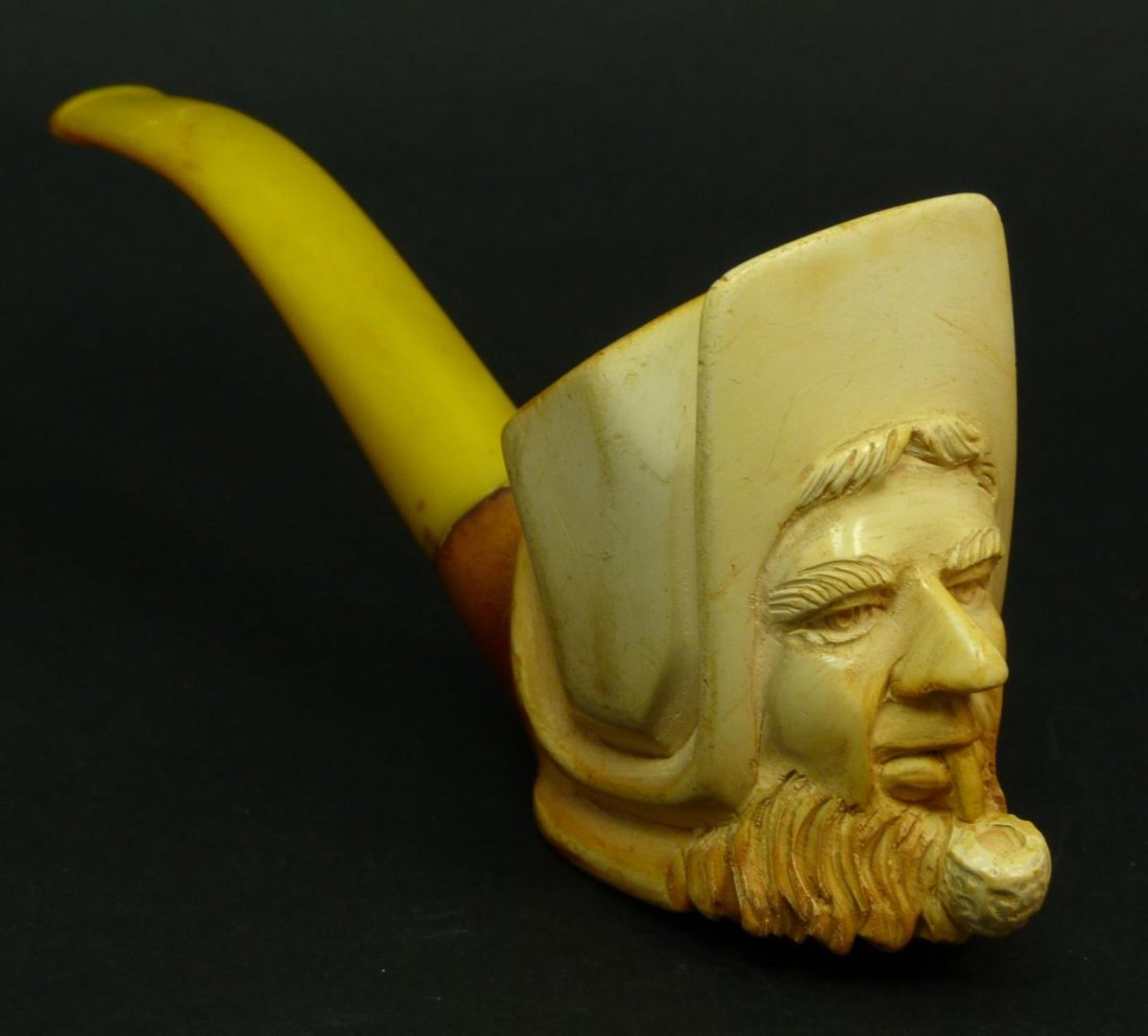 ANTIQUE MEERSCHAUM PIPE OF A FISHERMAN SMOKING: Antique Meerschaum pipe of a fisherman smoking a corn cob pipe. Measures 3" (7.62cm) Length with a 3" (7.62cm) bakelite mouth piece. Total weight 62g.