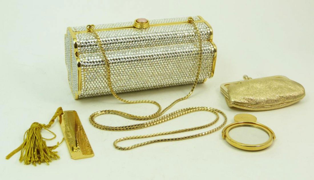 JUDITH LEIBER PURSE WITH SWAROVSKI CRYSTALS: Judith Leiber deco style shape purse with Swarovski crystal and a coral clasp. Complete with mirror and change purse. Also comes with dust cover and box. Measures 6" (15.24cm) Length. Total weight 530