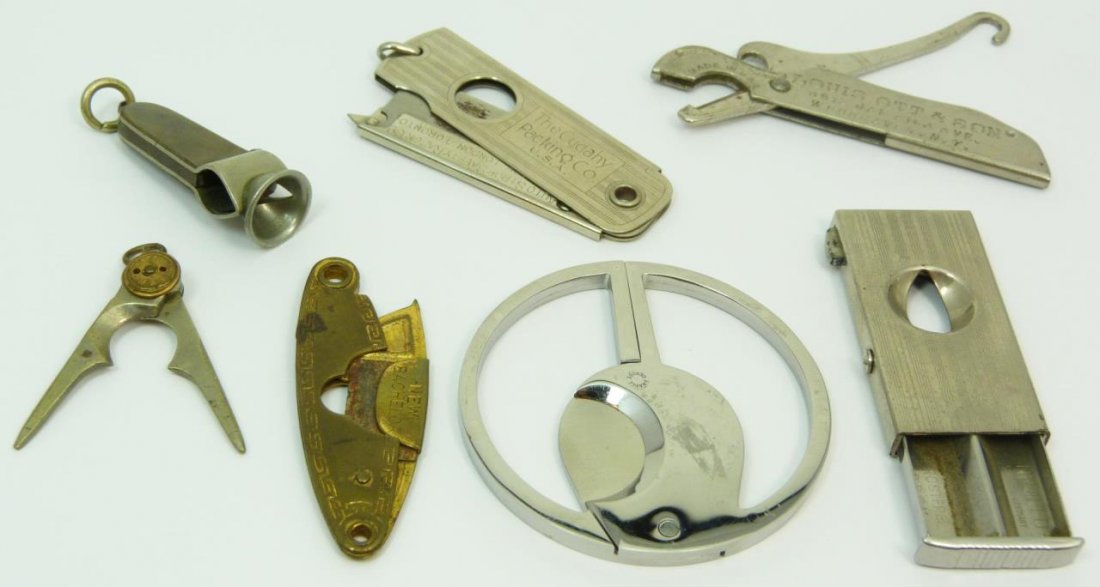 LOT OF 7 ANTIQUE CIGAR CUTTERS: Lot of 7 various antique cigar cutters. Some with advertisement. All from the early 20th century. Total approx weight 114g.