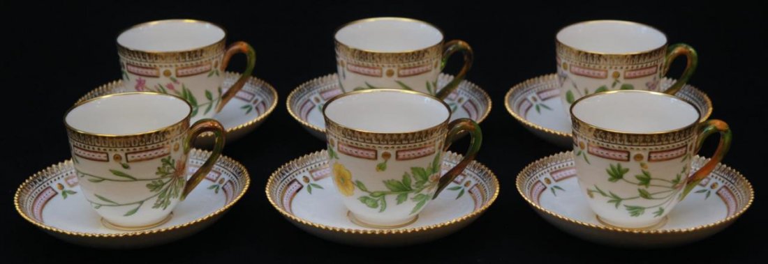 SET OF 6 FLORA DANICA HAND PAINTED CUPS & SAUCERS: Set of six Royal Copenhagen Flora Danica hand painted cups & saucers. Each signed with the Royal Copenhagen Flora Danica mark. Each measures approx 5 1/4" (13.33cm) Length x 2 1/2" (6.35cm) Height. To