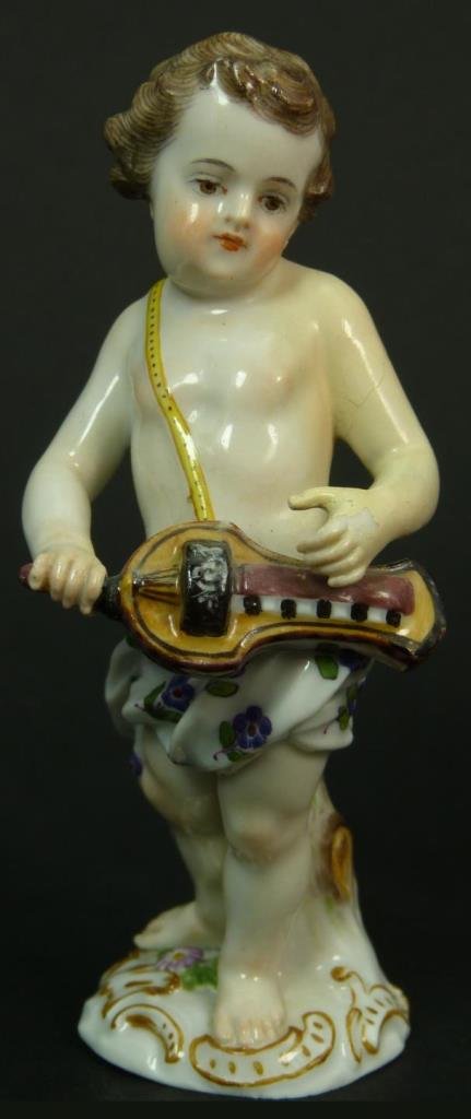 MEISSEN ANTIQUE FIGURINE OF A PUTTI: Early 20th century Meissen figurine of a Putti playing a violin. Measures approx 4 1/2" (11.43cm) Height. Total approx weight 134g.
