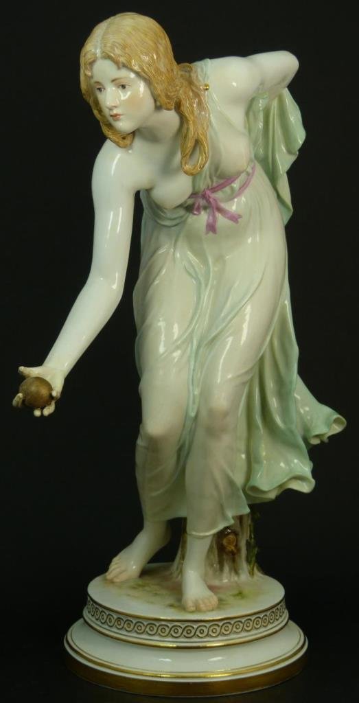 HUGE MEISSEN PORCELAIN FIGURINE OF A SEMI NUDE: Huge Meissen porcelain figurine of a lady playing with a ball with one of her breast's exposed. Cross swords mark under glaze to base. Turn of the century. Measures approx 14 1/2" (36.83cm) Height. To