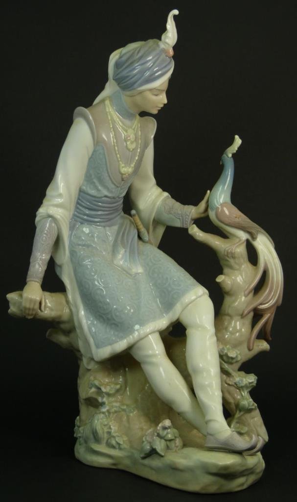 LLADRO "ARABIAN KNIGHT" 1310: Lladro "Arabian Knight" 1310 depicting Aladdin with a peacock. Retied in 1979. No box. Measures approx 13 1/4" (33.65cm) Height. Total approx weight 1.5kg.