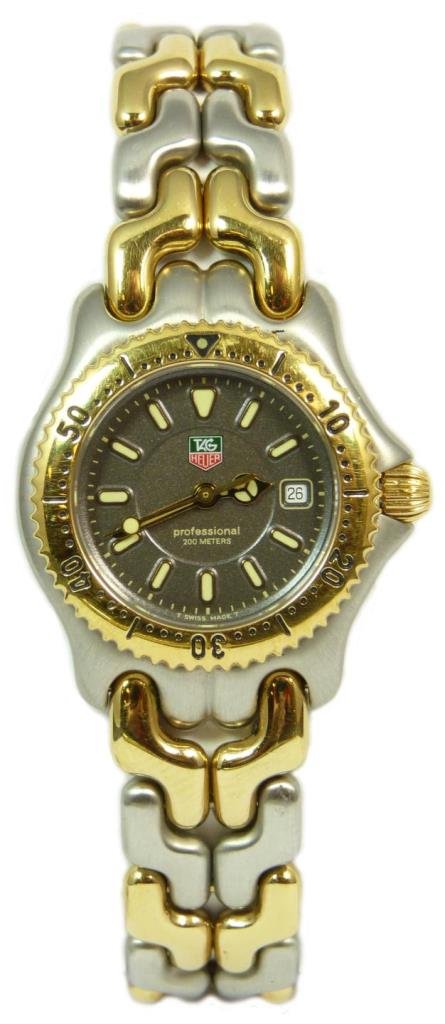 TAG HEUER TWO TONE STAINLESS WATCH w/ BOX & PAPERS: Tag Heuer Professional 200 Meters women's watch with two tone band and gold tone bezel. Watch has a black dial and white and gold hands. Comes with the original box and papers. Total approx weight 232