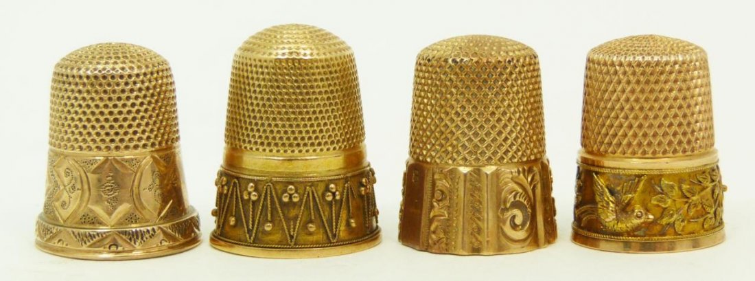 14KT YELLOW GOLD THIMBLES: Lot of four 14kt yellow gold thimbles. All knurled to top and sides. All have engraved patterns to exterior. Tallest measures 3/4" (1.91cm) Height. Total weight 13.5dwt.