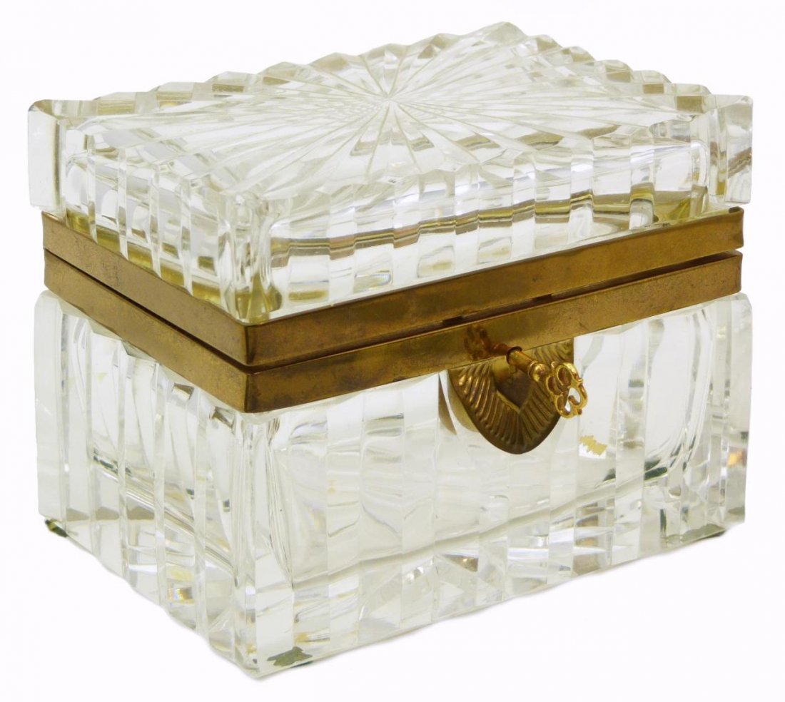 LARGE CONTINENTAL CUT CRYSTAL JEWELRY CASKET: Large continental cut crystal hinged jewelry box dates from the early to mid 20th century. To include original key. Measures 5 1/2" (13.97cm) Width x 4 1/4" (10.8cm) Height. Total approx weight 1.88kg