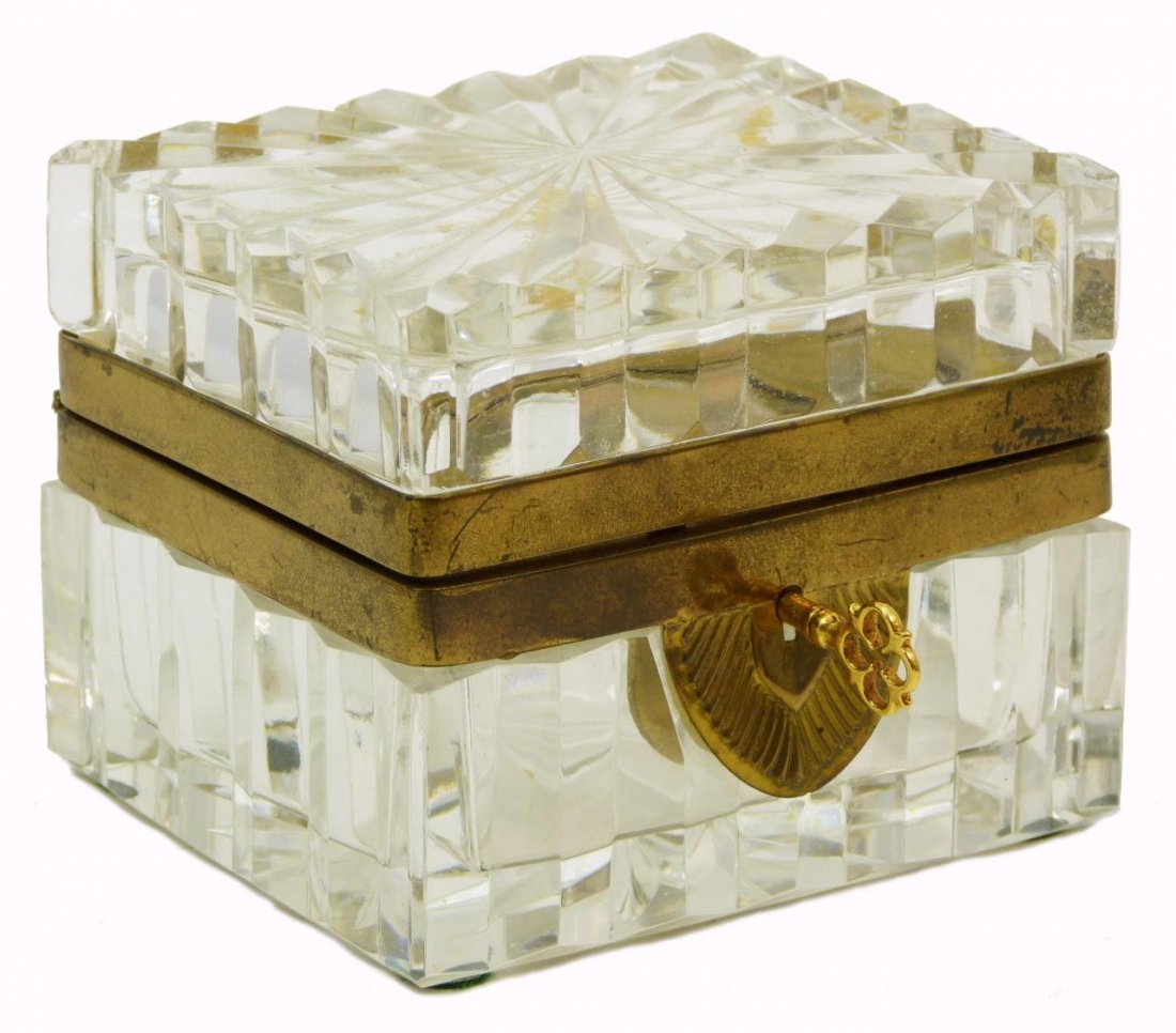 CONTINENTAL CUT CRYSTAL JEWELRY CASKET: Continental cut crystal hinged jewelry box dates from the early to mid 20th century. To include original key. Measures approx 3 7/8" (9.84cm) Width x 3 1/4" (8.25cm) Height. Total approx weight 909g.