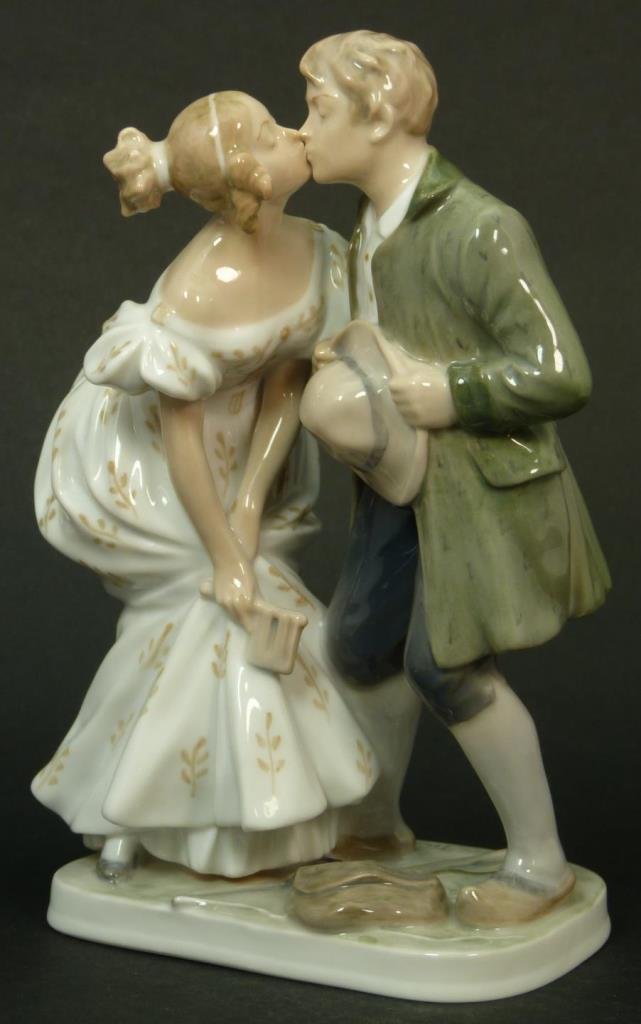 ROYAL COPENHAGEN KISSING COUPLE PORCELAIN FIGURINE: Rare Royal Copenhagen kissing couple porcelain figurine. Bears the green Royal Copenhagen Denmark mark to bottom. Measures approx 7 1/2" (19.05cm) Height. Total approx weight 545.4g.