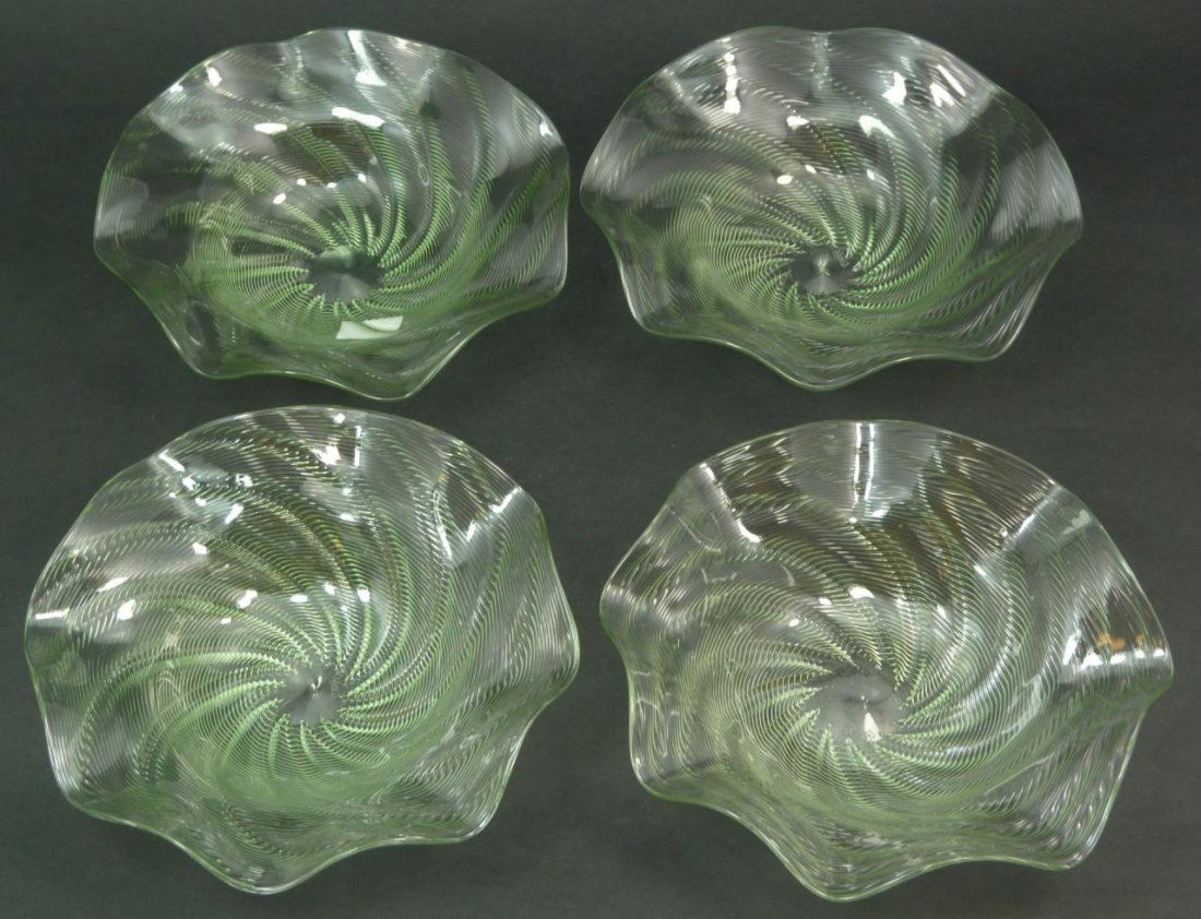 FOUR THOMAS WEBB HAND BLOWN RIBBON GLASS BOWLS: A collection of four hand blown ribbon glass bowls by the world renown factory Thomas Webb & Sons of England. Each measures approx 5 1/2" (13.97cm) Width. Signed Webb to base. Total approx weight 368g