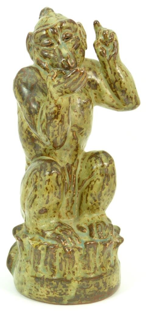 RARE ROYAL COPENHAGEN PORCELAIN MONKEY: Rare, Royal Copenhagen large porcelain figurine of a monkey in a green and brown glaze. Bears the Royal Copenhagen mark to base. Circa 1952. Measures approx 10 1/2" (26.67cm) Height. Total approx weig