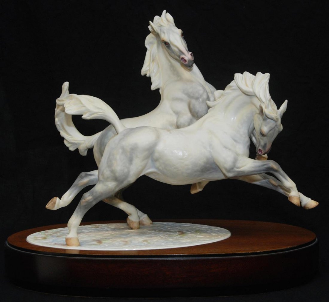 ROYAL WORCESTER "GALLOPING IN WINTER" PORCELAIN: Designed by Doris Lindner. Limited edition 48/250. Comes with certificate and appraisal for $5950.00. Comes on a personal wooden base. Measures approx 17" (43.18cm) Width x 14 1/2" (36.83cm) Height. T