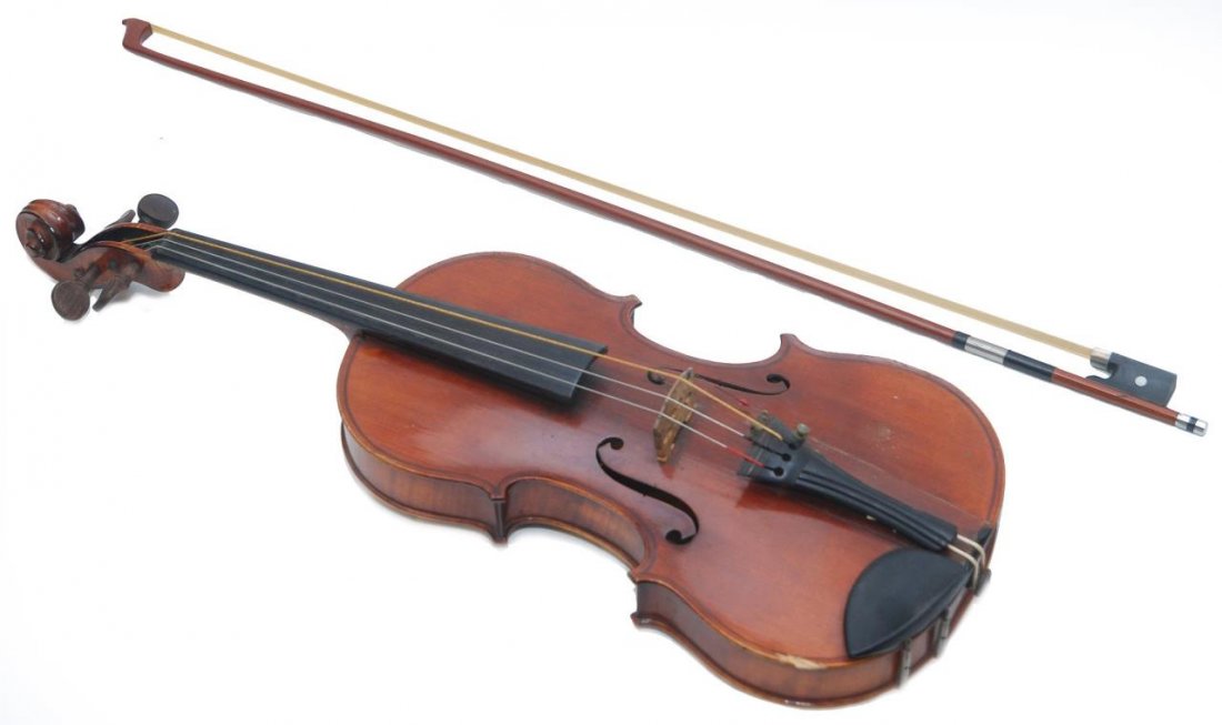 E. MARTIN STRADIVARIUS COPY VIOLIN: E. Martin Stradivarius copy violin with bow and case. Circa early 20th century. Violin measures approx 23 1/2" (59.69cm) Length. Bears the E. Martin sticker. Bow is unsigned. Total approx weight 1.95k