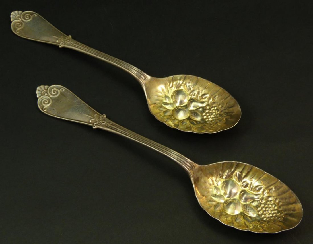 TIFFANY & CO. PR OF STERLING BERRY SPOONS 19TH C.: Pair of gold washed sterling silver Tiffany berry spoons. These spoons were sold by Starr & Marcus Jewelers of New York. Date to the last quarter of the 19th century. Each measures approx 8 1/2" (21.5