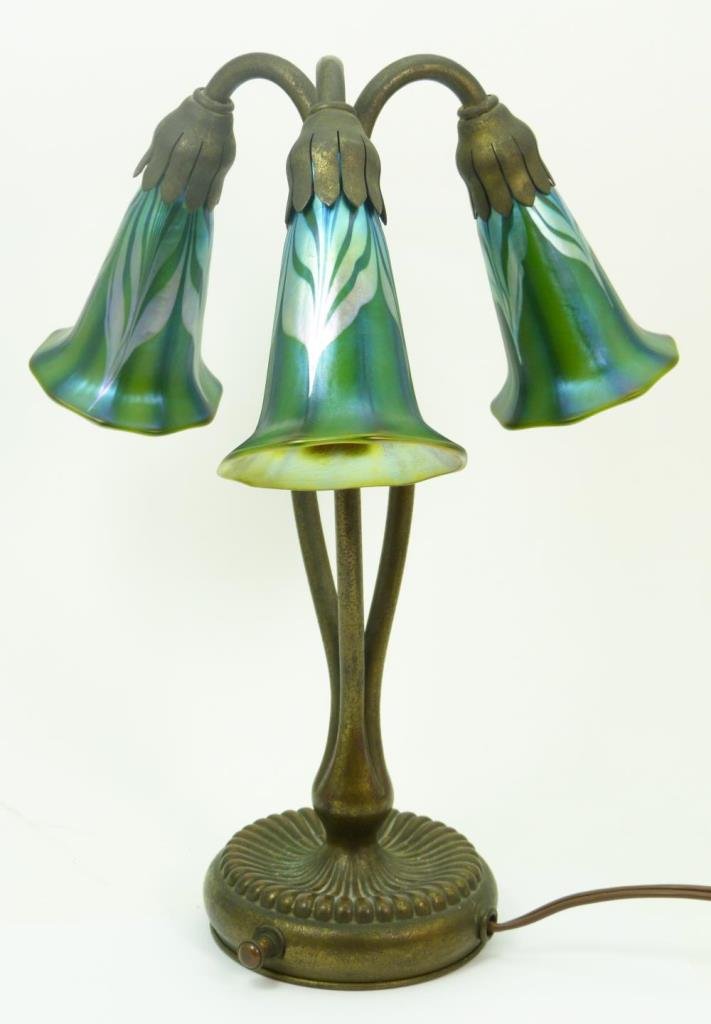ART GLASS LAMP & SHADES BEARS MARK TIFFANY STUDIOS: Three newer art glass shades. The base of the bronze is stamped Tiffany Studios New York and the numbers 319. Measures 13" (33.02cm) tall. Total weight of this lamp is 2469 grams
