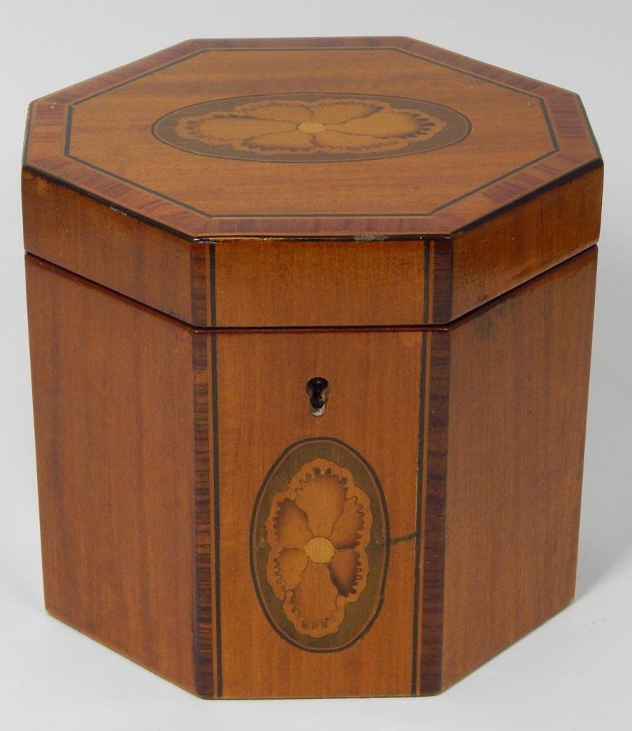 VINTAGE CONTINENTAL OCTAGONAL INLAID TEA CADDY: Vintage continental inlaid with a floral design on the front three panels and four various woods. Caddy measures approx 4 1/2" (11.43cm) Tall x 4" (10.16cm) Wide x 5" (12.7cm) Deep. Total approx weigh