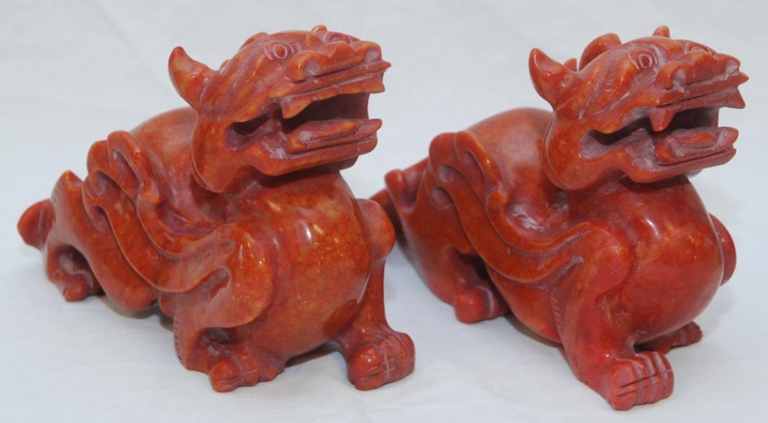 PAIR OF CHINESE RED HARD STONE FOO DOGS: Dates to the early 20th century. Each measures 8" (20.32cm) Length. Total approx weight 3.78kg.