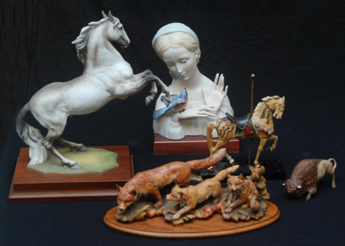 LOT OF FIVE MISCELLANEOUS FIGURINES/CARVINGS: To include an Italian Anri wood carving of foxes, a Kaiser porcelain figurine of a white horse, a Cybis porcelain bust of a blonde female with a blue jay, a carved Hamilton carnival horse and a Cybis