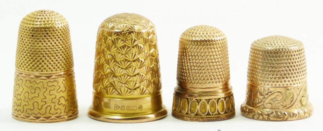 14KT YELLOW GOLD THIMBLES: Lot of four 14kt yellow gold thimbles. All knurled to top and sides. All have engraved patterns to exterior. Tallest measures 7/8" (2.25cm) Height. Total weight 10dwt.