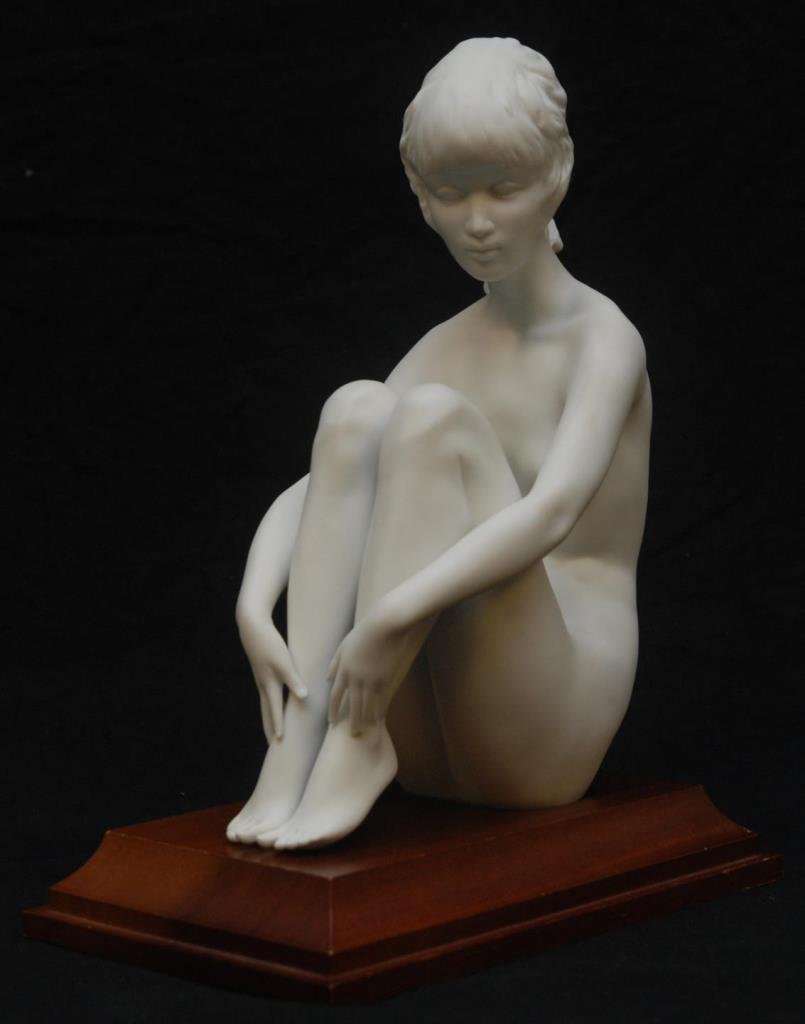 KAISER PORCELAIN FIGURINE OF A NUDE GIRL: Comes with a fitted wooden base. Signed to base in blue. Measures 9" (22.86cm) Tall. Total weight 1.19kg.