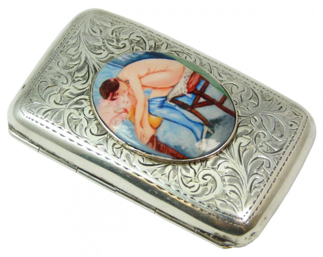 HENRY WILLIAMS Ltd. ENGLISH SILVER CIGARETTE CASE: A fabulous Henry Williams Limited English sterling silver cigarette case having a chased scroll design throughout with hand painted oval plaque of nude female. Gold wash interior with stretching bands