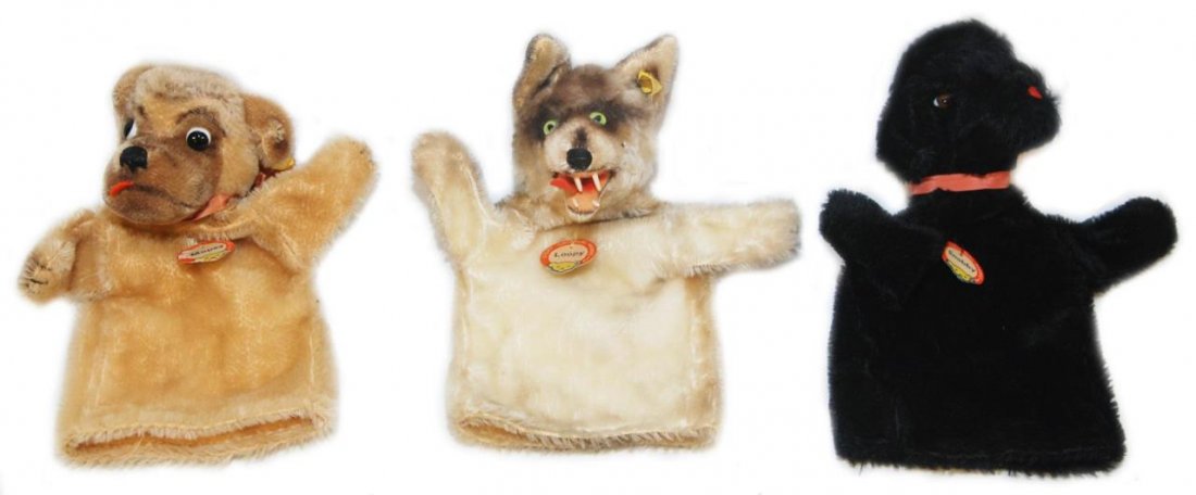 THREE STEIFF PUPPETS MOPSY, SNOBBY & LOOPY: To include Mopsy the pup, Snobby the poodle and Loopy the wolf. Circa mid century. Each measures approx 9" (22.86cm) Length. Total collective weight 208g. Each has the ribbon and button to the ear.