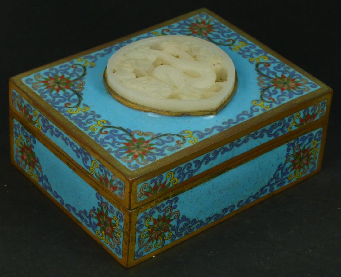 ANTIQUE CHINESE CLOISONNE RECTANGULAR BOX: Antique Qing period cloisonne gilt bronze box featuring a stunning even tone white Nephrite jade reticulated plaque depicting dragon with four talons, delicate cloud designs to back. Fabulous specimen