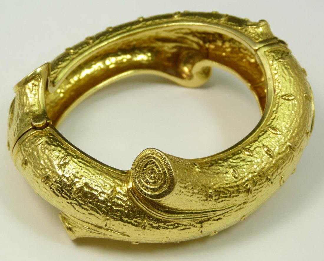 NICHOLAS VARNEY 18K YG TREE BRANCH BRACELET: A stunning and heavy Nicholas Varney 18k yellow gold bangle bracelet having a tree branch design. Marked 'N.VARNEY 18K' to underside of double catch clasp. Measures approx. 3 1/4" width x 2 3/4" lengt